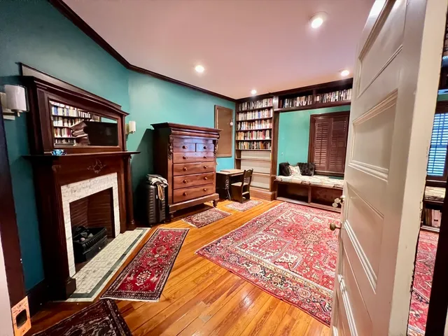 a bedroom with furniture and a flat screen tv