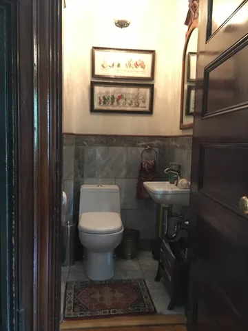 a bathroom with a toilet and a sink