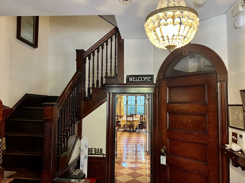 684 Washington Street Brookline, MA 02446 - Photo 3 of 30 a view of entryway and hall with wooden floor