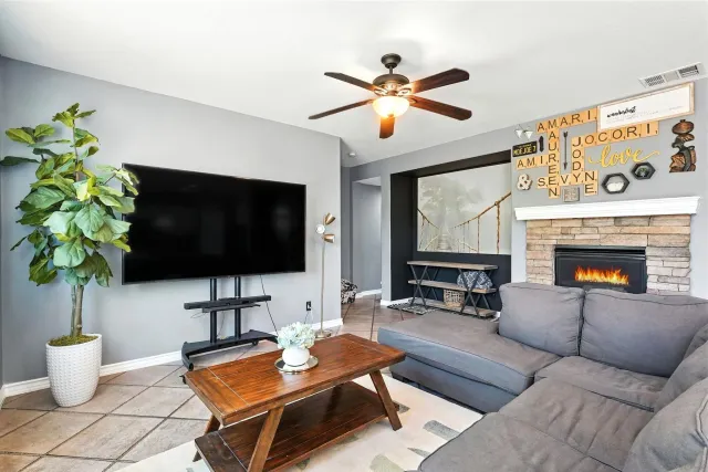 a dining room with furniture and a flat screen tv