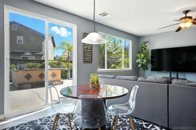a spacious bedroom with a large bed and a chandelier