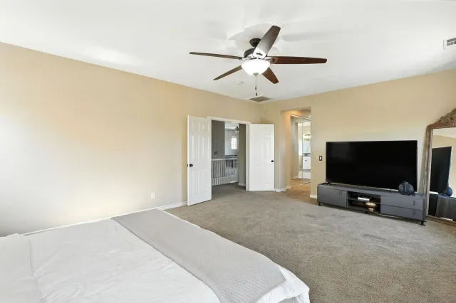 a bathroom with a granite countertop sink double and shower