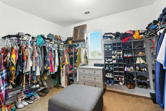 a living room with furniture and a mirror
