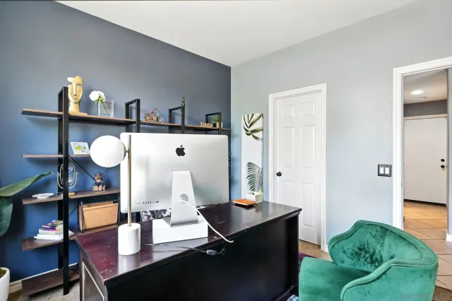 a view of backyard with outdoor seating and plants