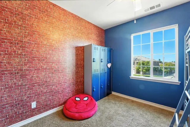 an aerial view of residential houses with outdoor space and ocean