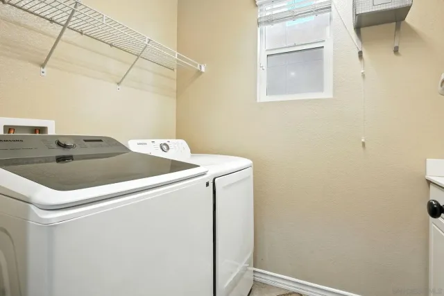 an aerial view of multiple houses with yard