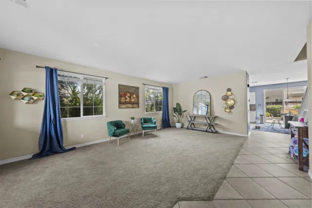 a dining room with furniture and a chandelier