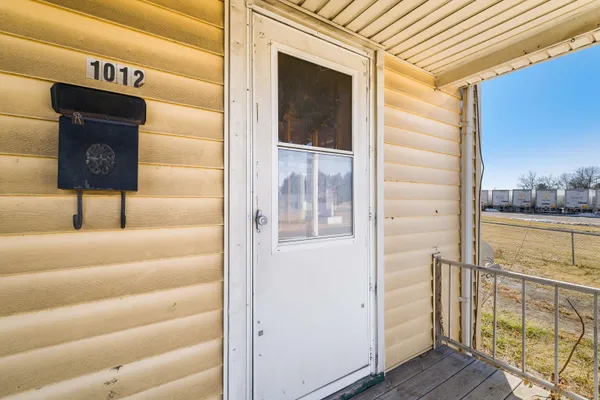 a view of a balcony with a door