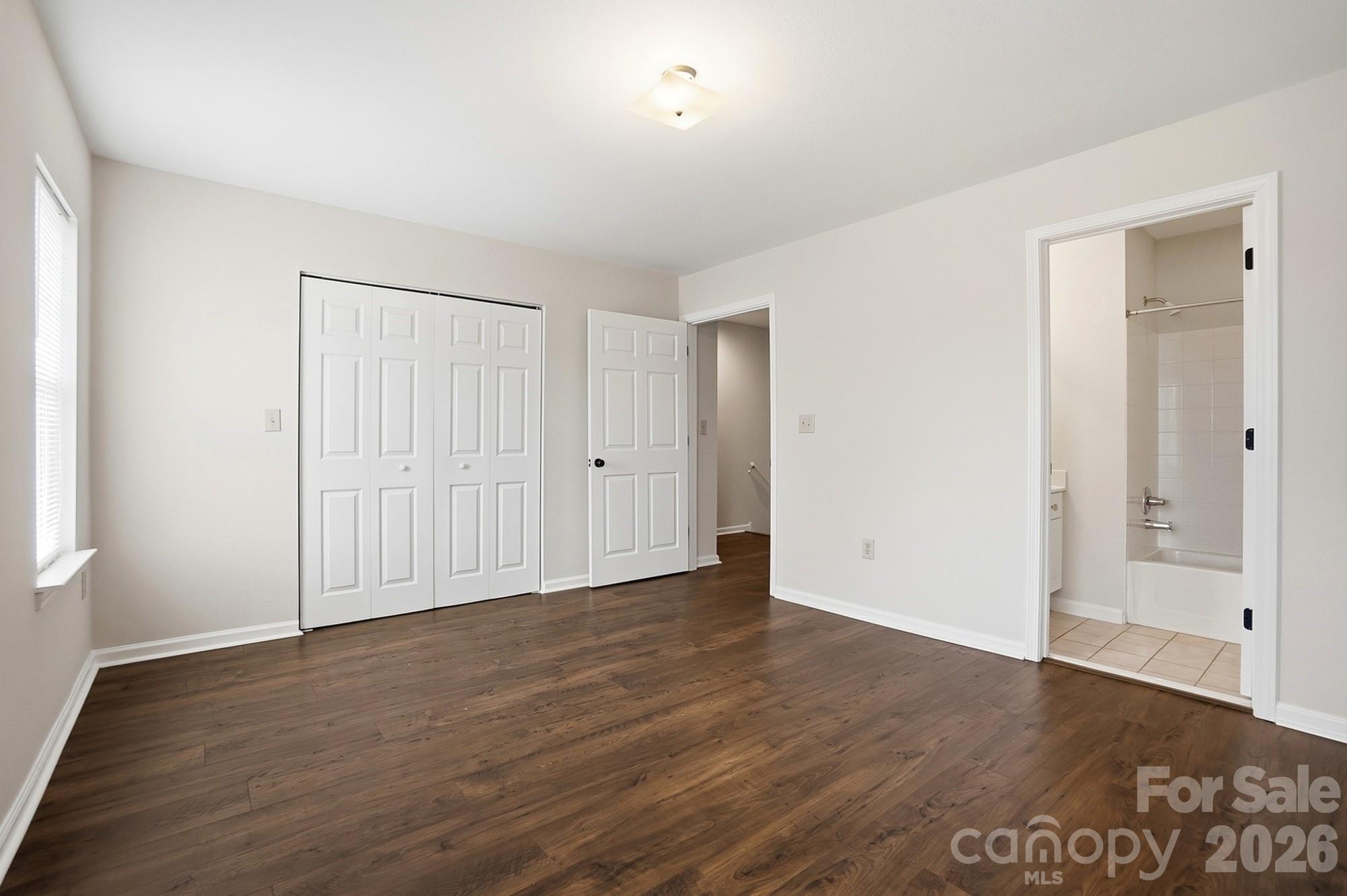 711 Stone Village Drive Fort Mill, SC 29708 - Photo 37 of 46 a view of an empty room with wooden floor and closet area