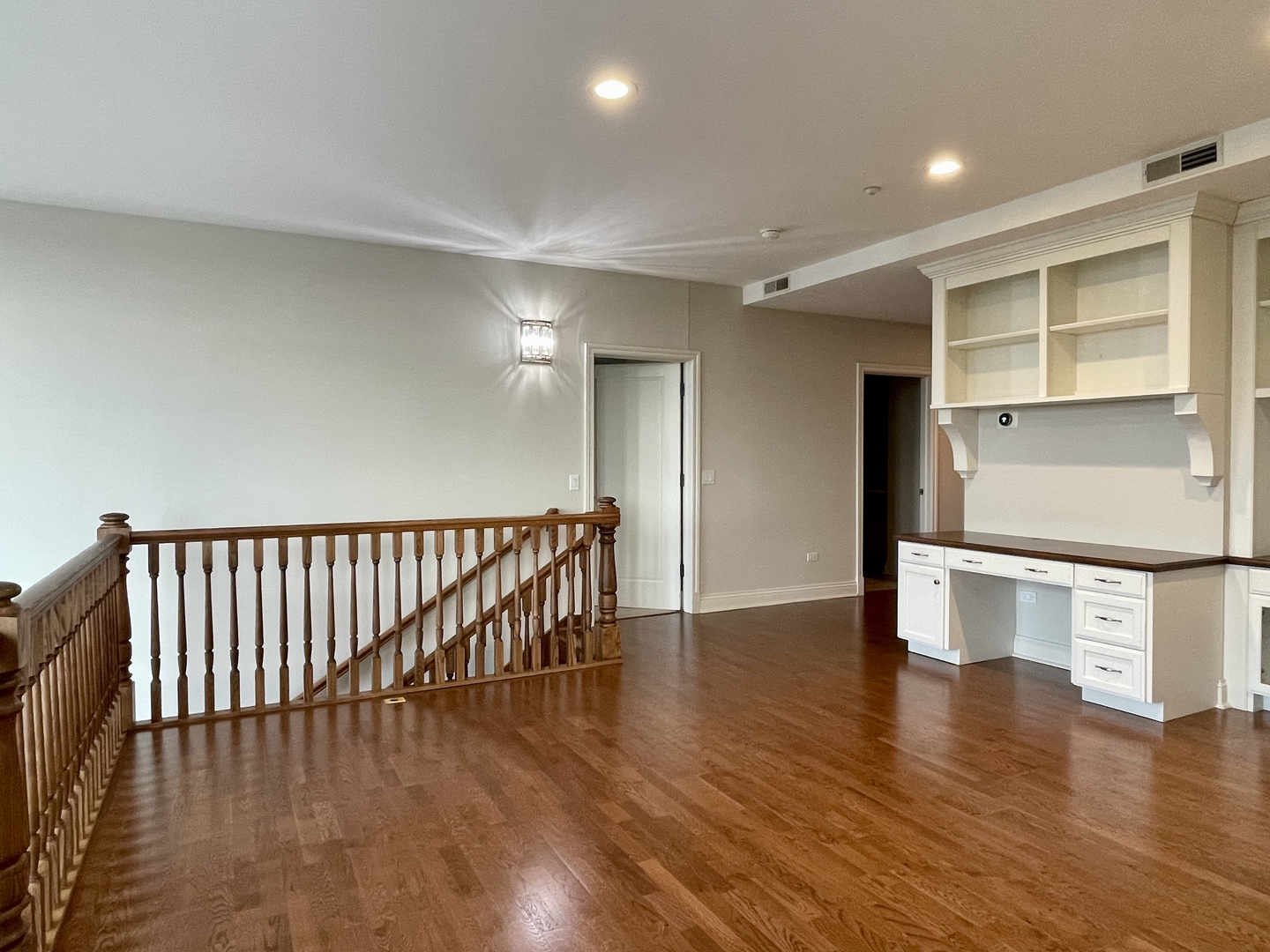 520 South Washington Street, Unit 604 Naperville, IL 60540 - Photo 21 of 32 a view of an empty room with wooden floor