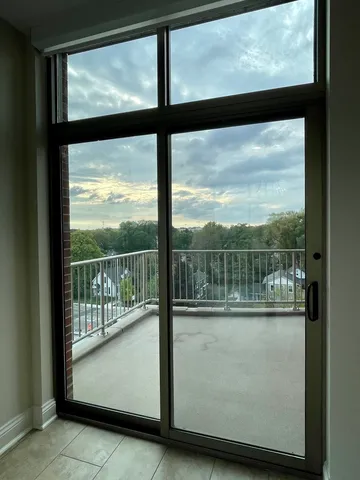 a view of a glass door with a view from a window
