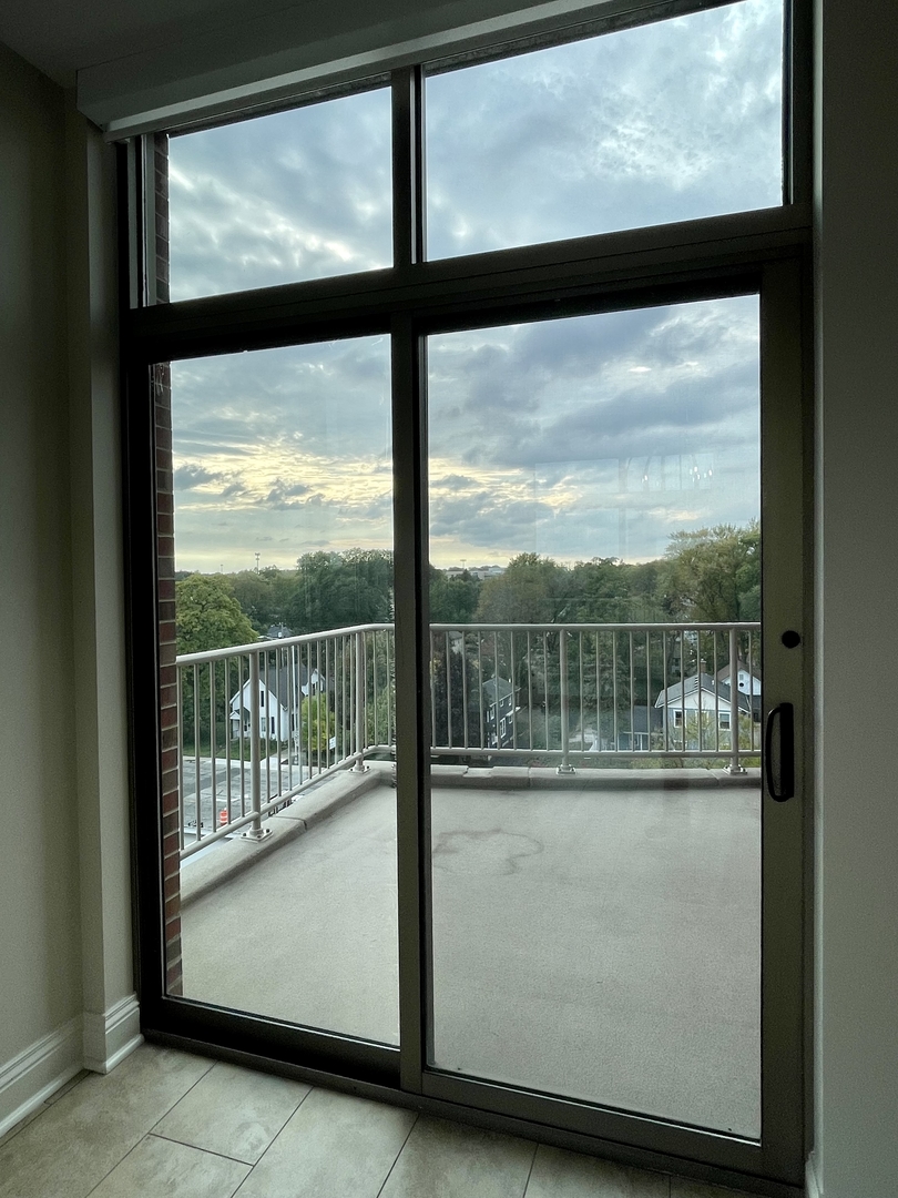 520 South Washington Street, Unit 604 Naperville, IL 60540 - Photo 29 of 32 a view of a glass door with a view from a window