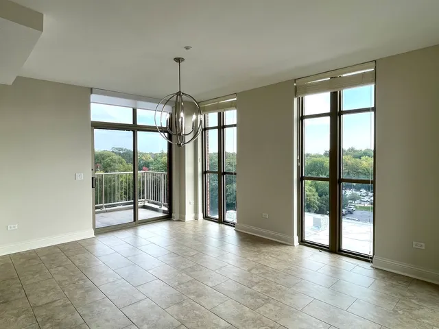 a view of an empty room with windows