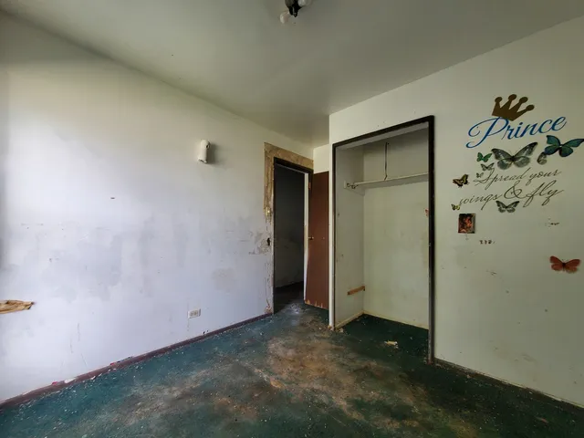 an empty room with a door