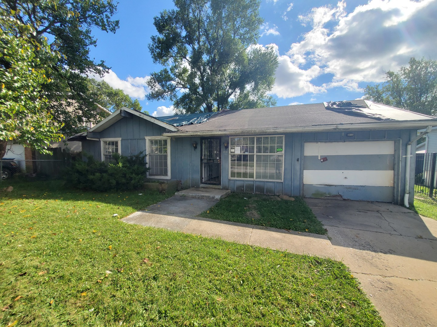2854 223rd Street Sauk Village, IL 60411 - Photo 18 of 18 a front view of a house with garden