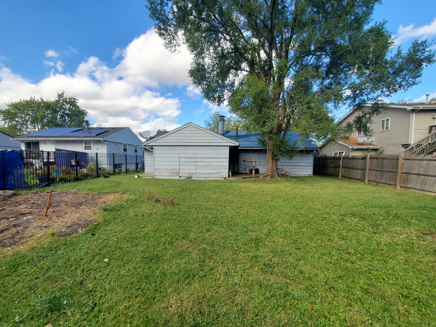 2854 223rd Street Sauk Village, IL 60411 - Photo 2 of 18 a house view with a garden space
