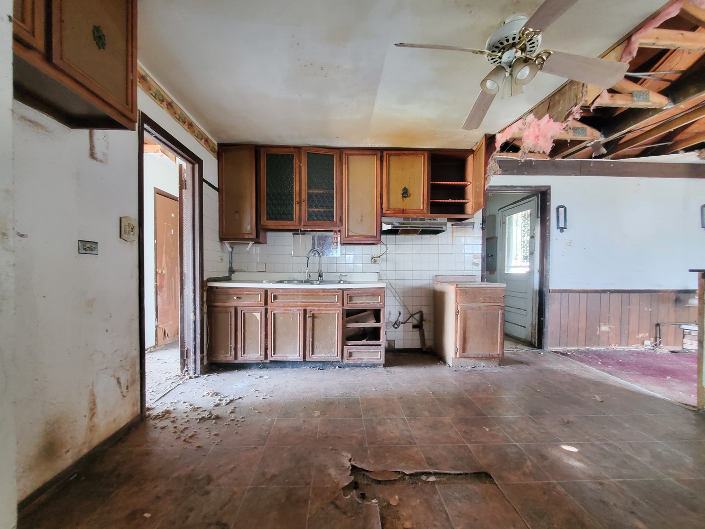 2854 223rd Street Sauk Village, IL 60411 - Photo 7 of 18 a kitchen with kitchen island granite countertop a sink cabinets and stainless steel appliances