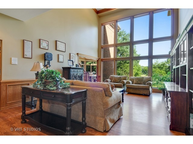 3737 Wolf Road Oswego, IL 60543 - Photo 2 of 25 a living room with furniture and a large window
