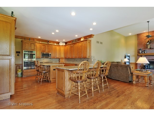 3737 Wolf Road Oswego, IL 60543 - Photo 11 of 25 a view of a dining room with furniture