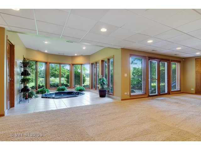 3737 Wolf Road Oswego, IL 60543 - Photo 12 of 25 a view of a livingroom with furniture floor to ceiling window and floor to ceiling window
