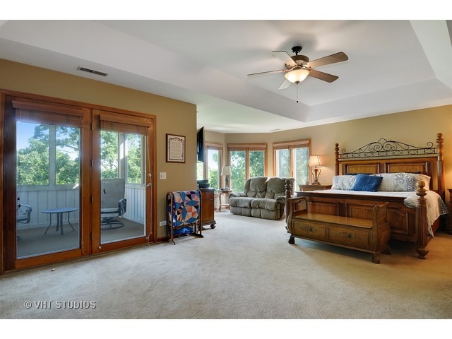 3737 Wolf Road Oswego, IL 60543 - Photo 15 of 25 a bedroom with furniture and a large window