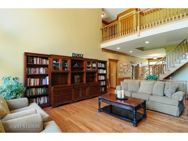 3737 Wolf Road Oswego, IL 60543 - Photo 3 of 25 a living room with furniture and a book shelf