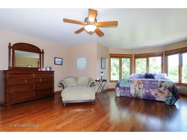 3737 Wolf Road Oswego, IL 60543 - Photo 21 of 25 a living room with furniture and wooden floor