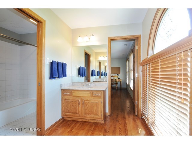 3737 Wolf Road Oswego, IL 60543 - Photo 23 of 25 a view of living room with a sink and wooden floor