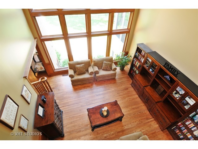 3737 Wolf Road Oswego, IL 60543 - Photo 4 of 25 a living room with furniture and a floor to ceiling window