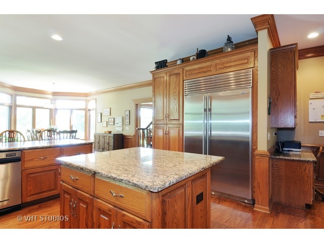 3737 Wolf Road Oswego, IL 60543 - Photo 5 of 25 a kitchen with a sink refrigerator and cabinets