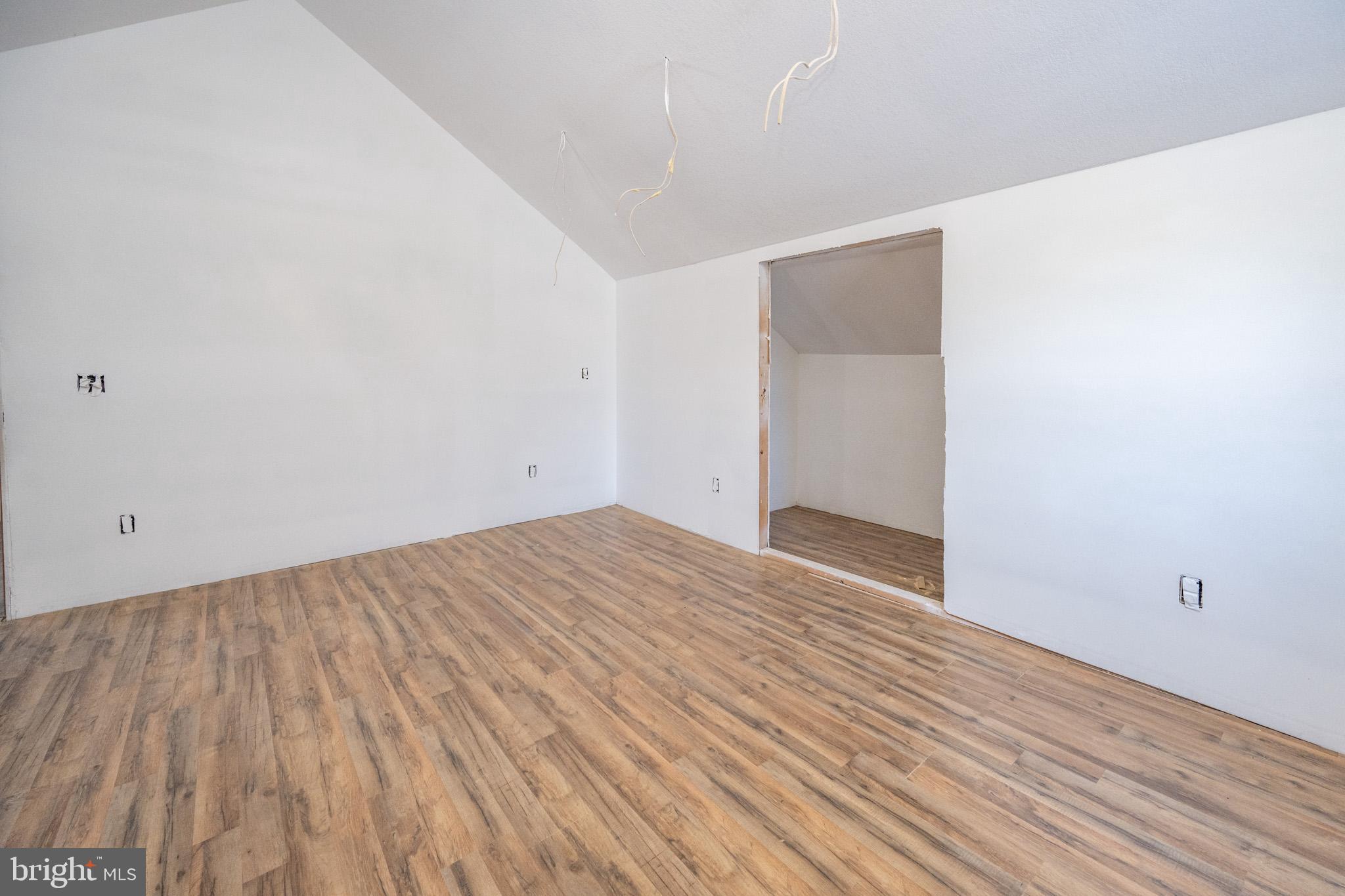 43 Sloan Tract Road Oakland, MD 21550 - Photo 41 of 47 Spacious room with modern wood flooring.