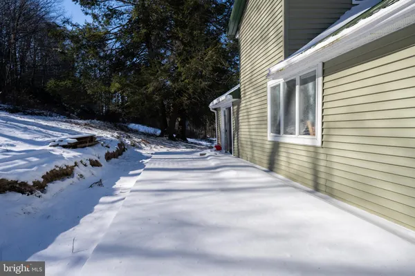 a view of backyard with a white house