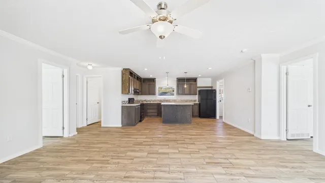a view of kitchen with wooden floor