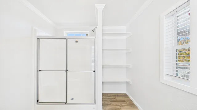 a view of walk in closet with window