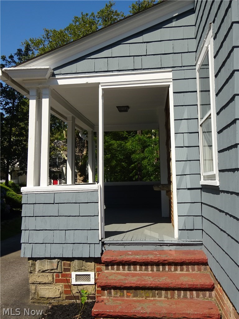 971 Roanoke Road Cleveland, OH 44121 - Photo 12 of 19 Shady side porch leads to the back yard.