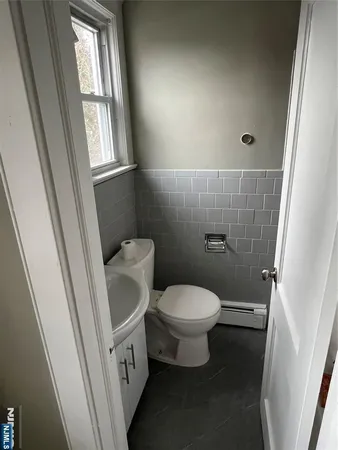 a bathroom with a toilet and a sink