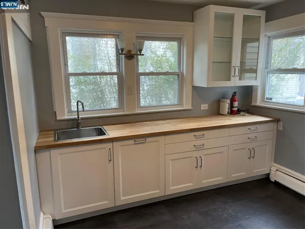 a kitchen with sink and window