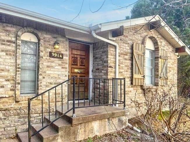 9914-9916 Brockbank Drive Dallas, TX 75220 - Photo 1 of 12 a view of a building with a glass door