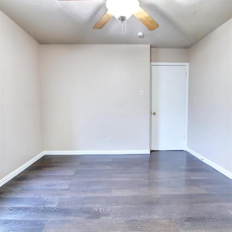 9914-9916 Brockbank Drive Dallas, TX 75220 - Photo 11 of 12 a view of an empty room with wooden floor