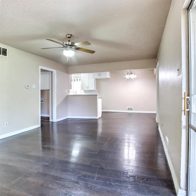 9914-9916 Brockbank Drive Dallas, TX 75220 - Photo 2 of 12 a view of an empty room with wooden floor