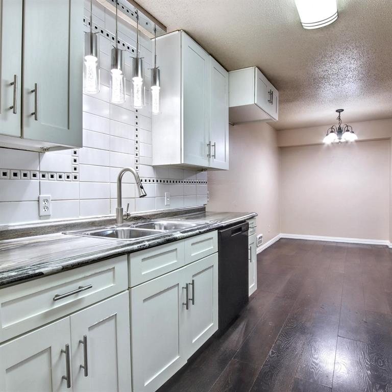 9914-9916 Brockbank Drive Dallas, TX 75220 - Photo 4 of 12 a kitchen with stainless steel appliances granite countertop a sink a stove and cabinets