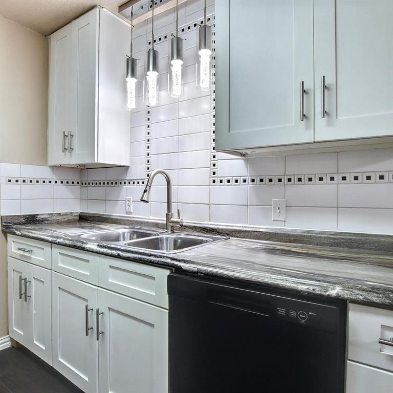 9914-9916 Brockbank Drive Dallas, TX 75220 - Photo 5 of 12 a kitchen with granite countertop a sink and cabinets