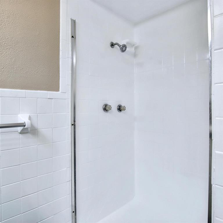 9914-9916 Brockbank Drive Dallas, TX 75220 - Photo 8 of 12 a bathroom with a shower