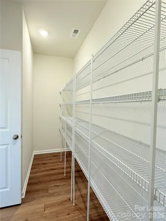 a view of an empty walk in closet