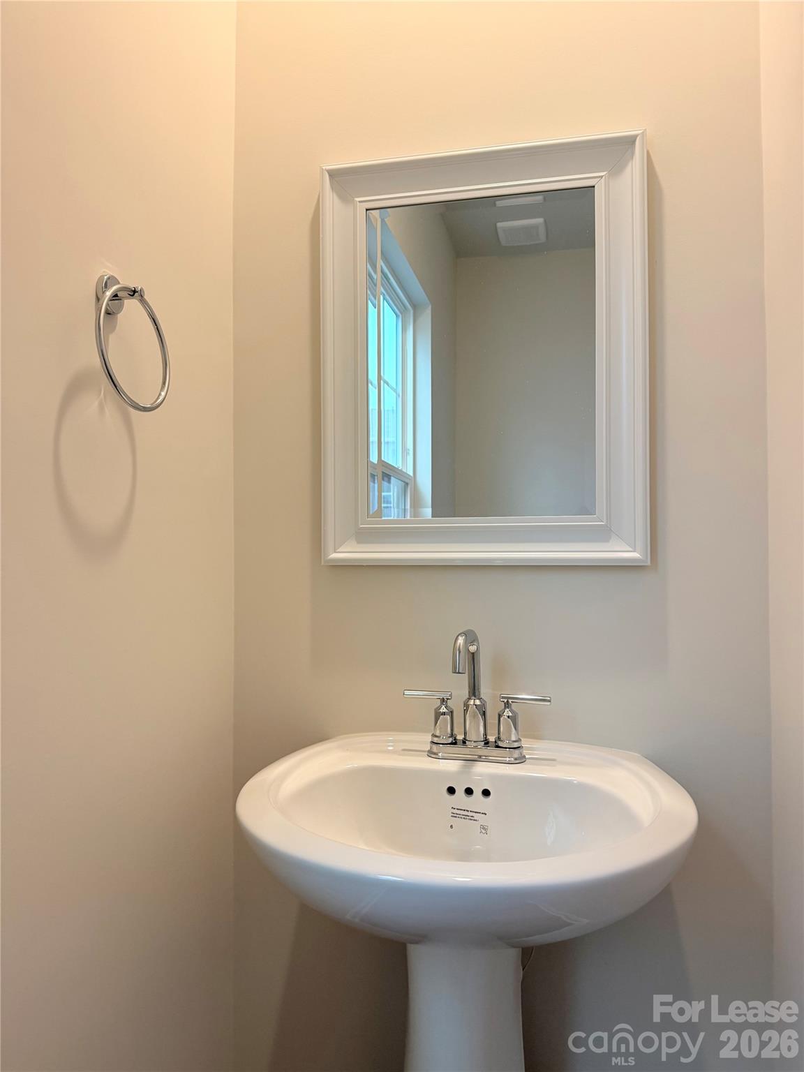 4345 Shimmering Stone Way Maiden, NC 28650 - Photo 12 of 27 a bathroom with a sink a mirror and vanity