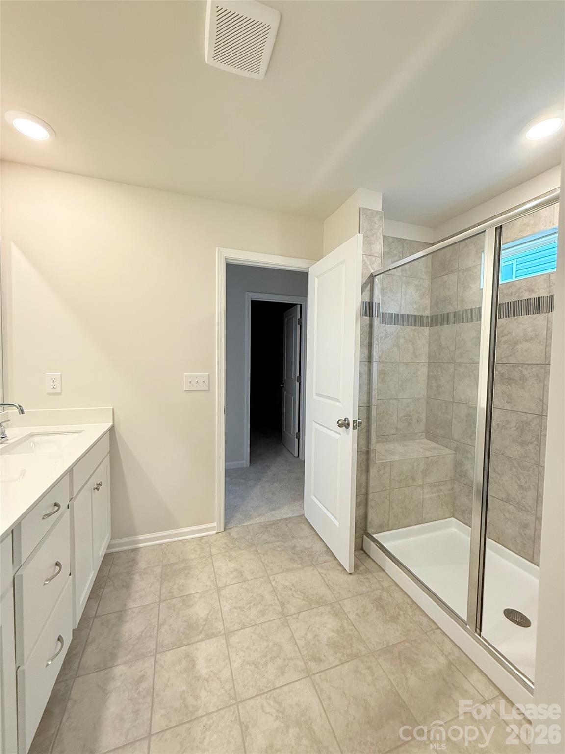4345 Shimmering Stone Way Maiden, NC 28650 - Photo 17 of 27 a bathroom with a shower and a sink