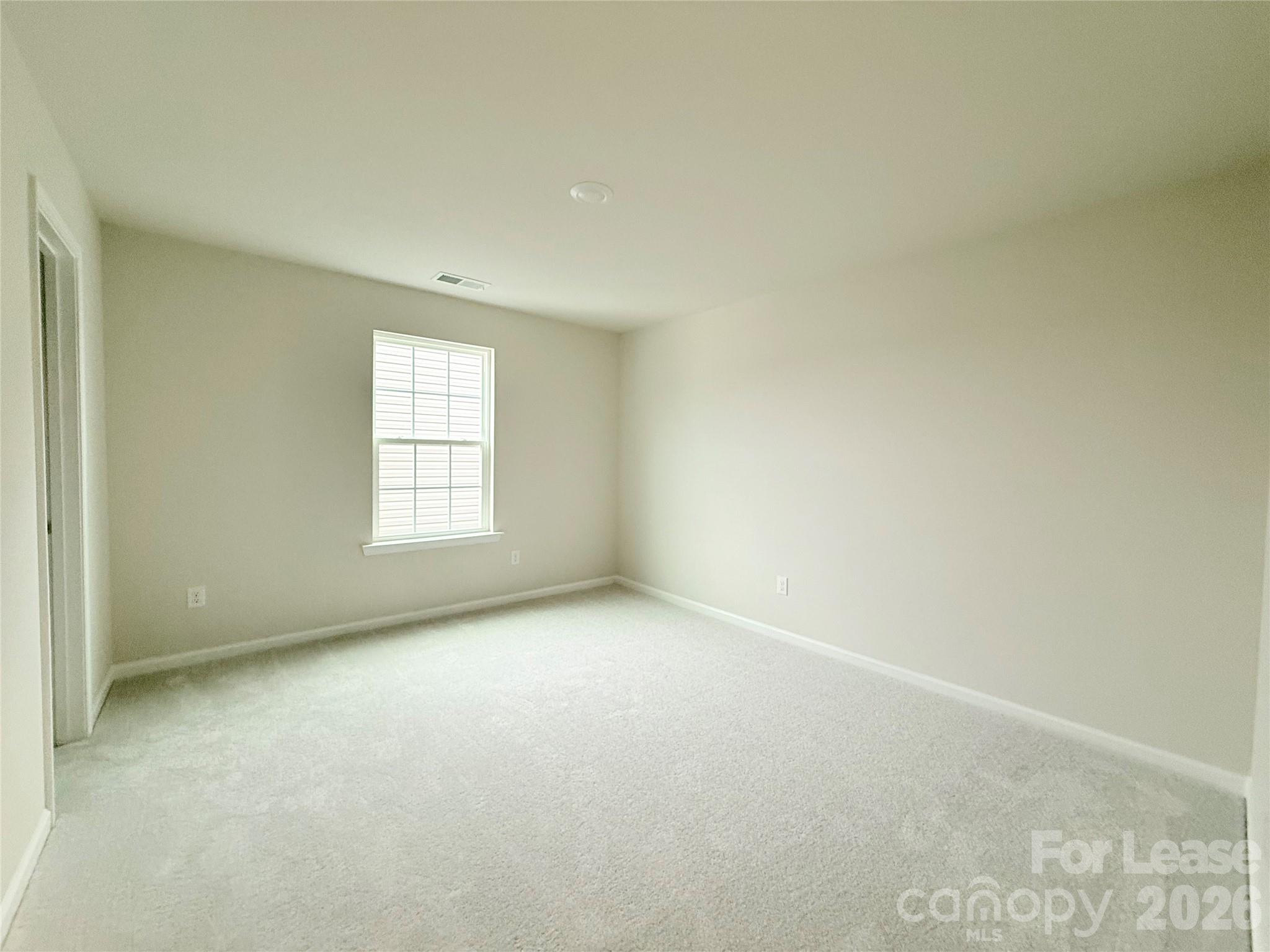 4345 Shimmering Stone Way Maiden, NC 28650 - Photo 22 of 27 an empty room with windows