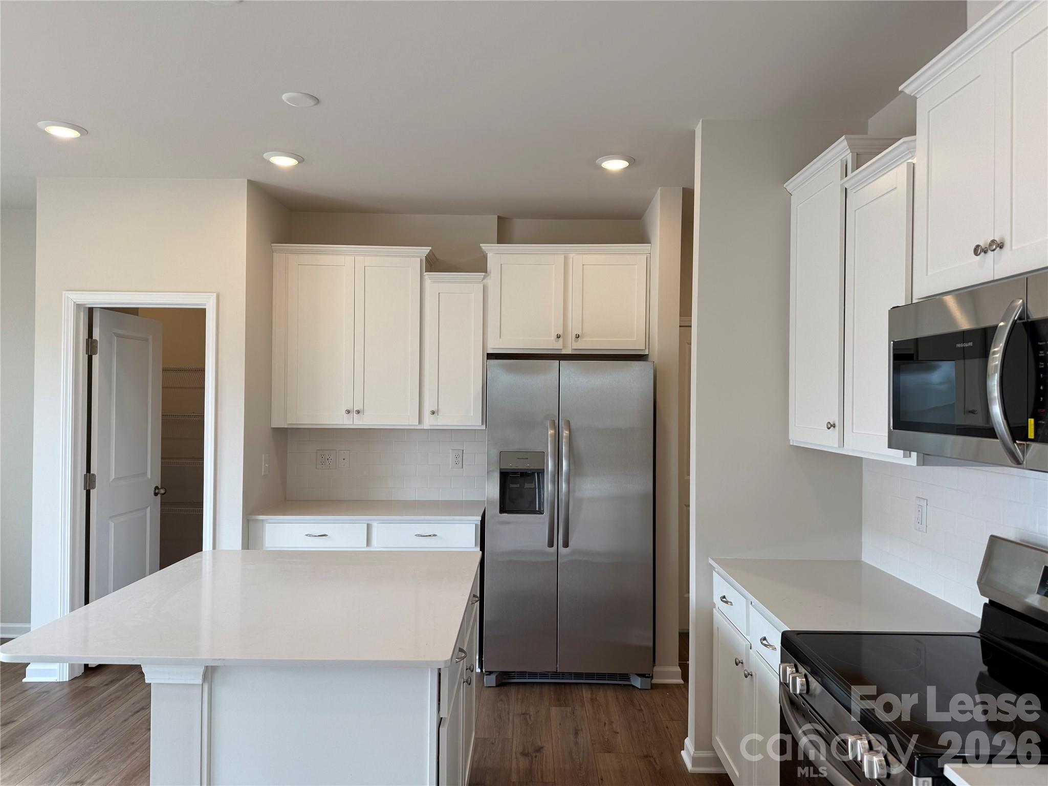 4345 Shimmering Stone Way Maiden, NC 28650 - Photo 10 of 27 a kitchen with kitchen island a counter top space stainless steel appliances and cabinets