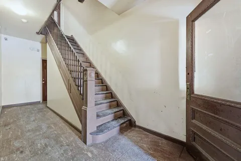 a view of a hallway with staircase