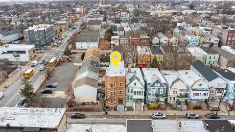 an aerial view of residential building with parking space
